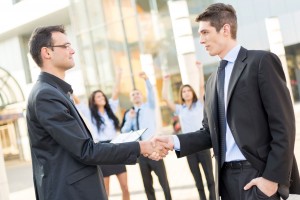 two mens shaking hands become a member
