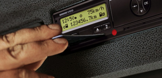 driver inserting card on the tachograph